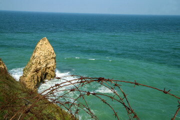The detail of the old barbed wire at Pointe du Hoc in Normandy in France. The place of the famous...