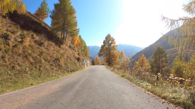 Passo Gavia, Italy. Driving shot, vehicle point of view. Camera on car roof. Time lapse driving on the mountain road that lead to the Gavia mountain pass