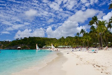 White clouds over the tropical white sand beach of la caravelle, Guadeloupe 