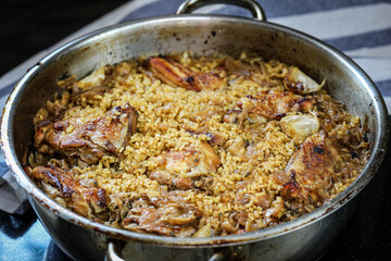 Stewed chicken with onion confit and bulgur.