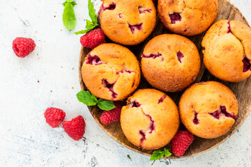 Naklejka na ściany i meble Homemade Raspberry Muffins on Wooden Plate