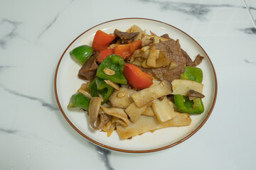Traditional Chinese cuisine: Stir-fried beef with mushrooms