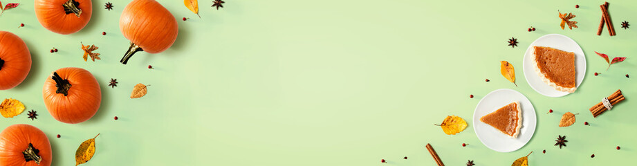 Pumpkin pie with autumn pumpkins - overhead view