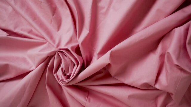 Pink satin bed linen of premium quality. The texture of the fabric