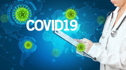 Doctor fills out medical record with COVID19 inscription, virology concept