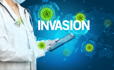 Doctor fills out medical record with INVASION inscription, virology concept