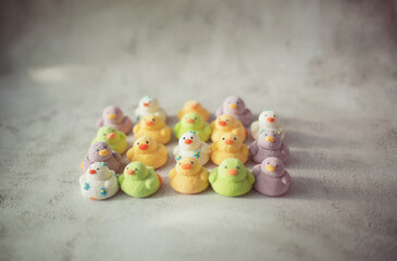 
marshmallows in the form of ducks of different colors