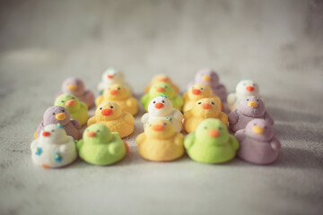
marshmallows in the form of ducks of different colors
