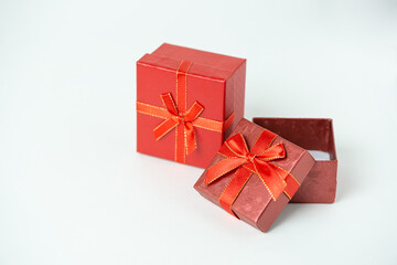 Red  open gift boxes with ribbon and bow on white background. For new year, Christmas, Valentine's day and other holiday compositions copy space for text