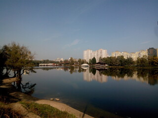 urban skyline reflected in the water