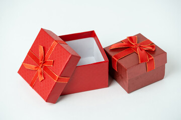 Red gift boxes with ribbon and bow on white background. For new year, Christmas, Valentine's day and other holiday compositions