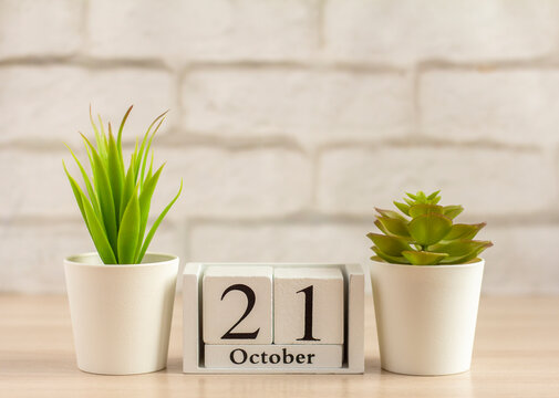 October 21 on the calendar on a light wooden background.Date of the autumn month.