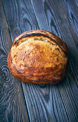 Homemade tartine bread on dark wooden table