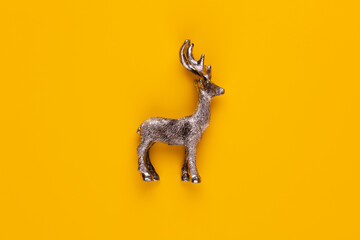 Christmas star decor on yellow colored background.