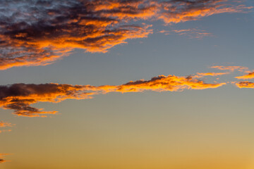 Sunset illuminating the clouds in the sky.