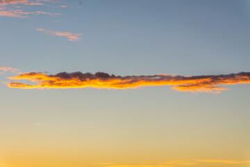 Sunset illuminating the clouds in the sky.