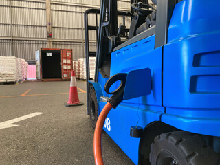 Electrical forklift vehicle park and plug in for charging battery inside of logistic warehouse....