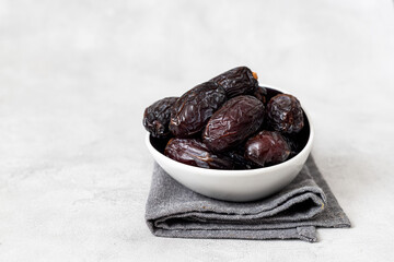 Juicy organic Medjool dates  on  background