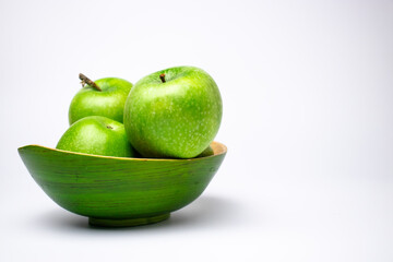 The plate of ripe apples. Green focus picture with white background 
