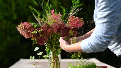 Florist making a bouquet of flowers