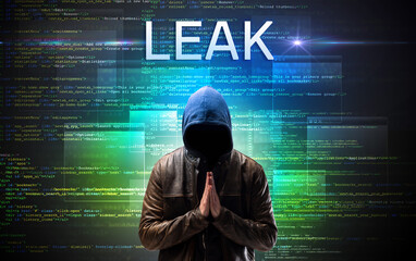 Faceless hacker with LEAK inscription on a binary code background