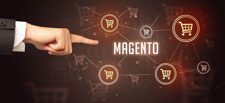 Close-Up of cropped hand pointing at MAGENTO inscription, online shopping concept