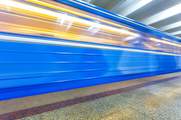 Subway train in motion at the underground station