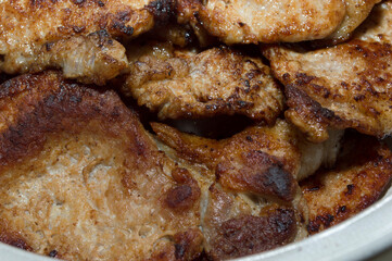 Process of cooking. Fried meat. Pork chop.