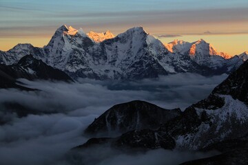 Obraz premium Scenic beautiful sunset visible on Thamserku Mountain as seen from Gokyo Ri near Gokyo, Sagarmatha Khumbu Region, Nepal Himalaya