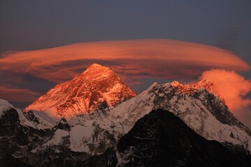 Scenic red sunset on Mount Everest Sagarmatha and Lhotse as seen from Gokyo Ri with cloud above...