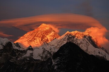 Scenic red sunset on Mount Everest Sagarmatha and Lhotse as seen from Gokyo Ri with cloud above Everest, Gokyo, Sagarmatha Khumbu Region, Nepal Himalaya