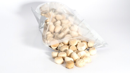 Close up of Thai mini cookies. Thai call “Khanom Ping” A type of traditional Thai dessert consisting of many small, often brightly coloured.