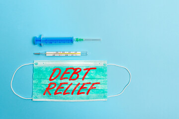 Handwriting text Debt Relief. Conceptual photo partial or total remission of it especially those by...