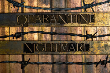 Quarantine Nightmare text formed with real authentic typeset letters surrounded by barb wire on...