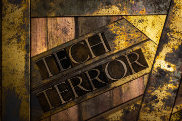 Tech Terror text message with green confirmation sign on vintage textured grunge copper and gold background