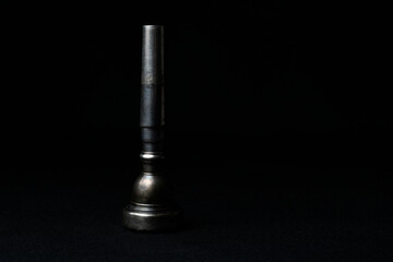 Obraz na płótnie Canvas Used trumpet mouthpiece silver color