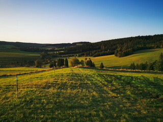 Fototapeta premium Green meadow in the mountain scenery.