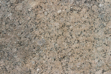 The texture of a natural stone slab from polished granite.