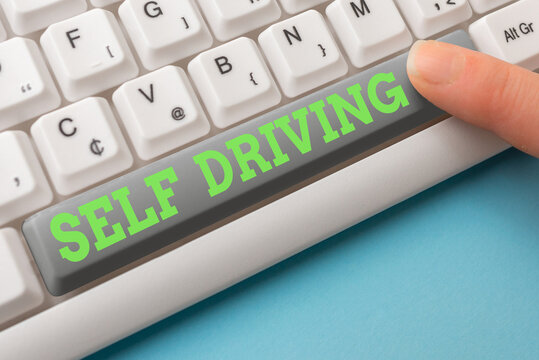 Word writing text Self Driving. Business photo showcasing Autonomous vehicle Ability to navigate without input Different Colored PC keyboard key With Accessories on Empty background