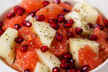 Fresh fruit salad in bowl. Concept healthy food, diet, vegan. Close up