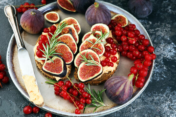 Healthy sweet figs fruit toast with cheese, honey and flower. Fresh fig fruit bread