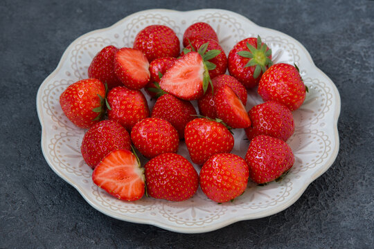 Fresh Strawberries On White Plate On Gray Background