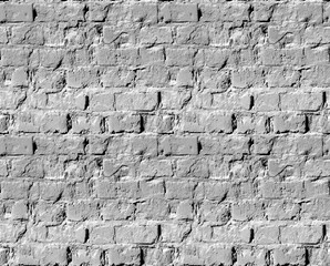 Seamless pattern. The texture of the old broken brick. Grey color.