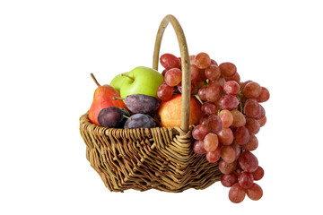 Naklejka na ściany i meble Basket with fruits and grape isolated on white