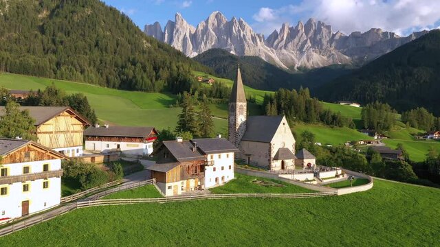 Aerial of the beautiful Santa Maddalena Church, Val Di Funes, Dolomites, Northern Italy