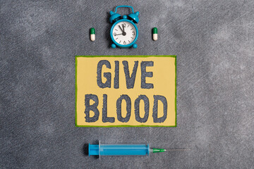 Word writing text Give Blood. Business photo showcasing an individual voluntarily has blood drawn...