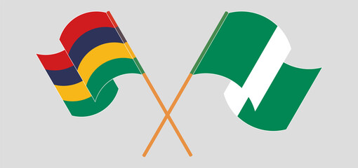 Crossed and waving flags of Nigeria and Mauritius