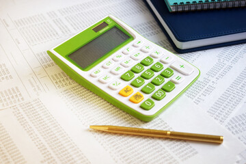 Calculator and pencil. Office equipment at workplace. Conceptual image of desk work, financial paperwork and business economy.