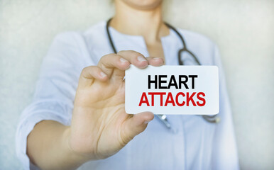 A doctor in a white coat holds a card with the inscription, medical concept.