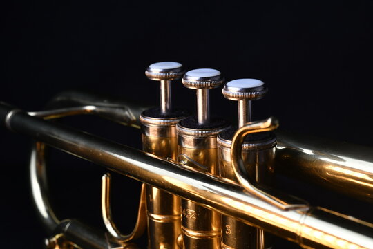Brass instruments, golden trumpet in the dark